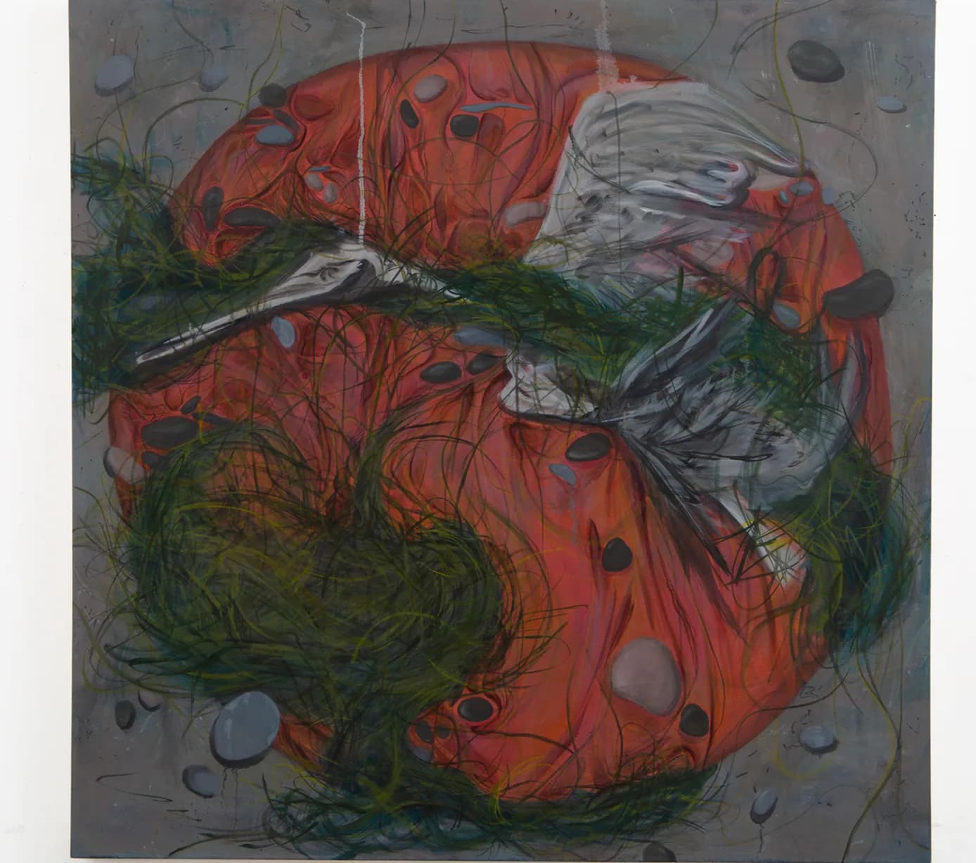 Large-scale painting with bird, red circle, stones, and green grass on grey ground
