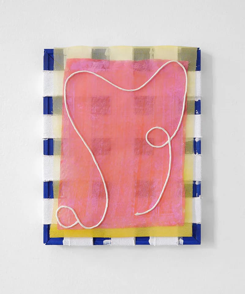 Abstract mixed-media wall piece with pink painted canvas, white rope line, blue and yellow striped border