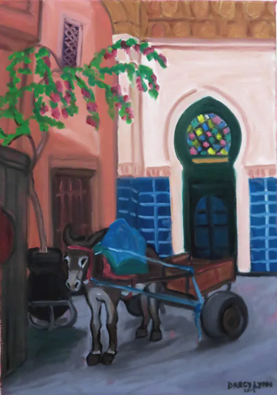 Donkey cart outside a Moorish arched doorway in Marrakech