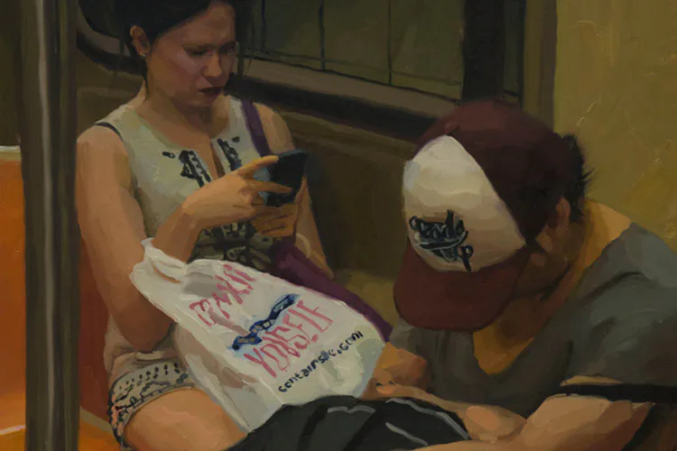 Two people examining a white t-shirt with printed text and graphics indoors.