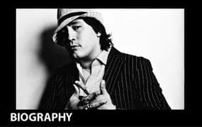 Black and white photograph of a person wearing a hat and suit, labeled 'BIOGRAPHY'.