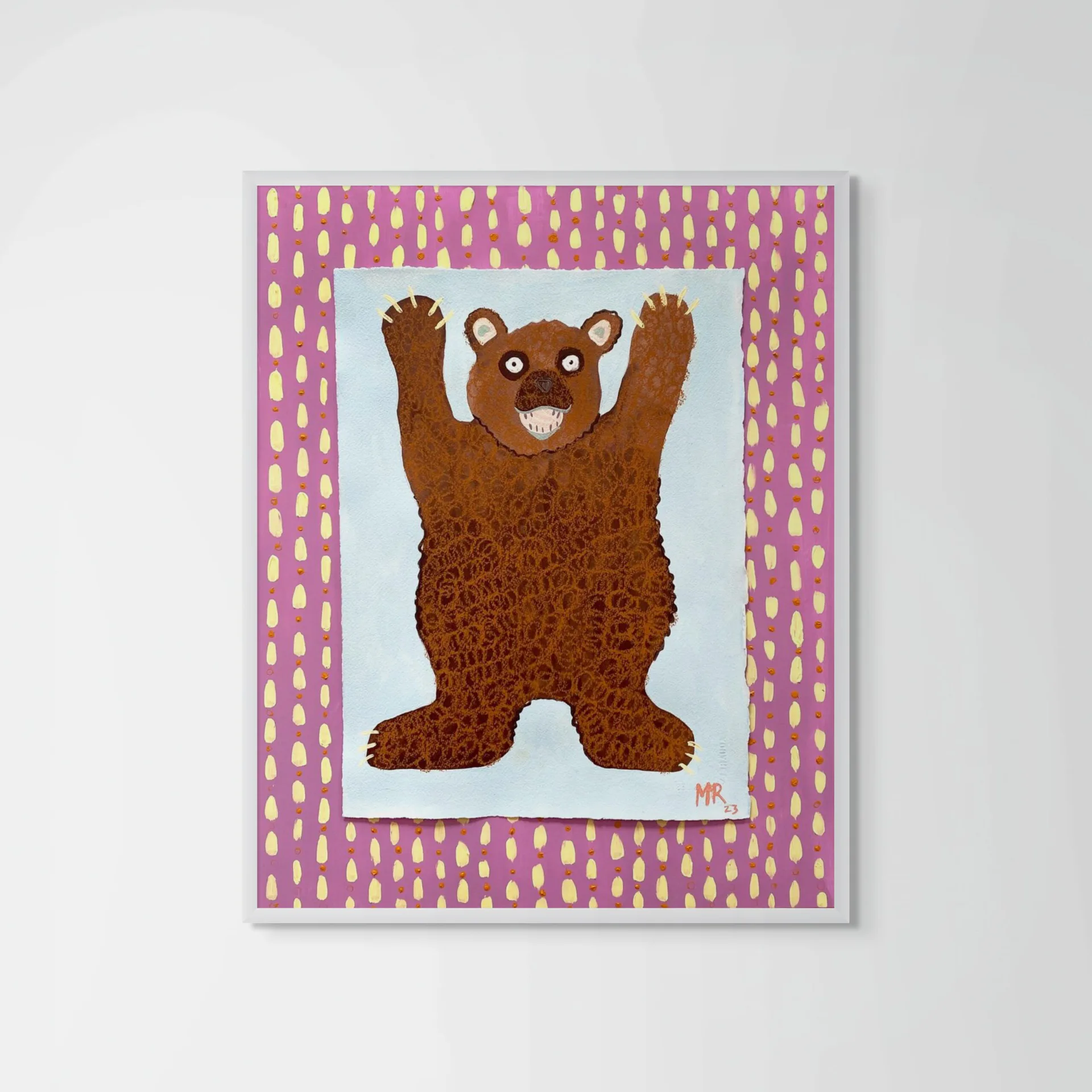 Painting of a brown bear with raised arms on white background, framed by pink border with yellow dot pattern.