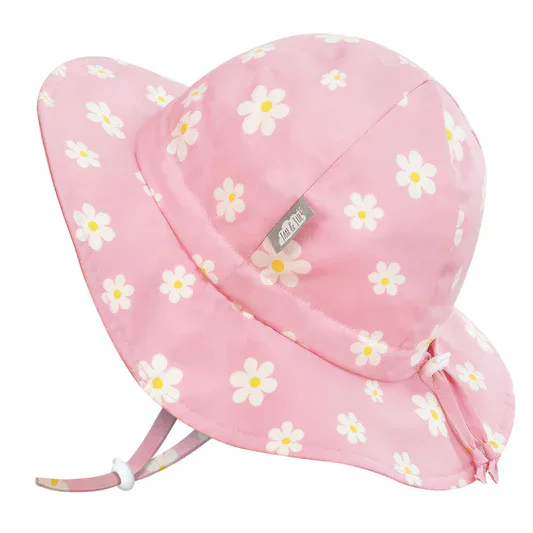 Pink wide-brimmed sun hat with white and yellow daisy flower pattern and adjustable strap.