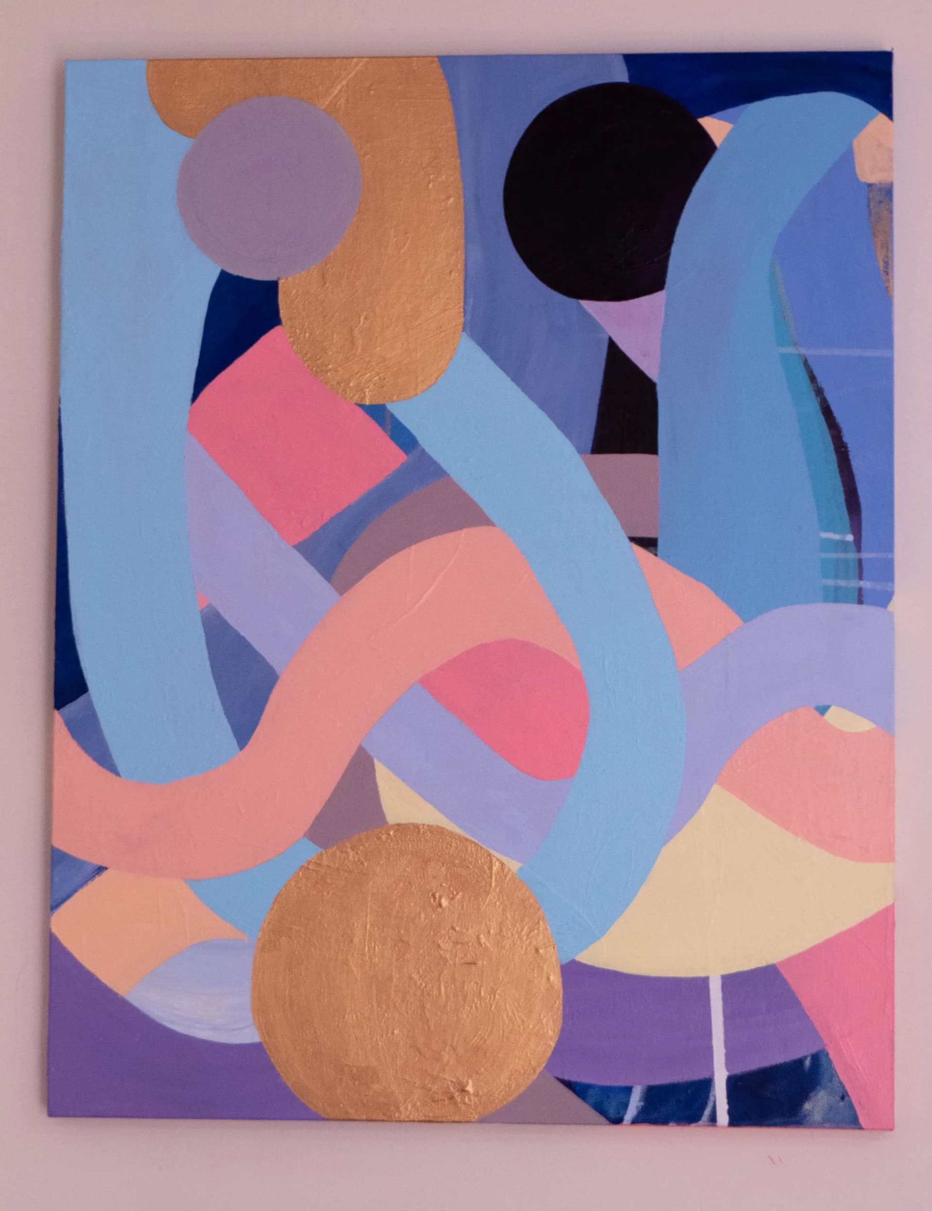 Geometric abstract painting with interlocking curved ribbons in blue, pink, and lavender with gold leaf circles