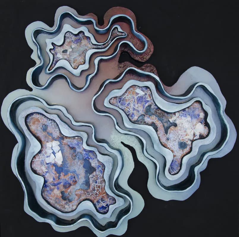Abstract ceramic wall piece with layered organic forms in blue, grey, and earth tones on black background