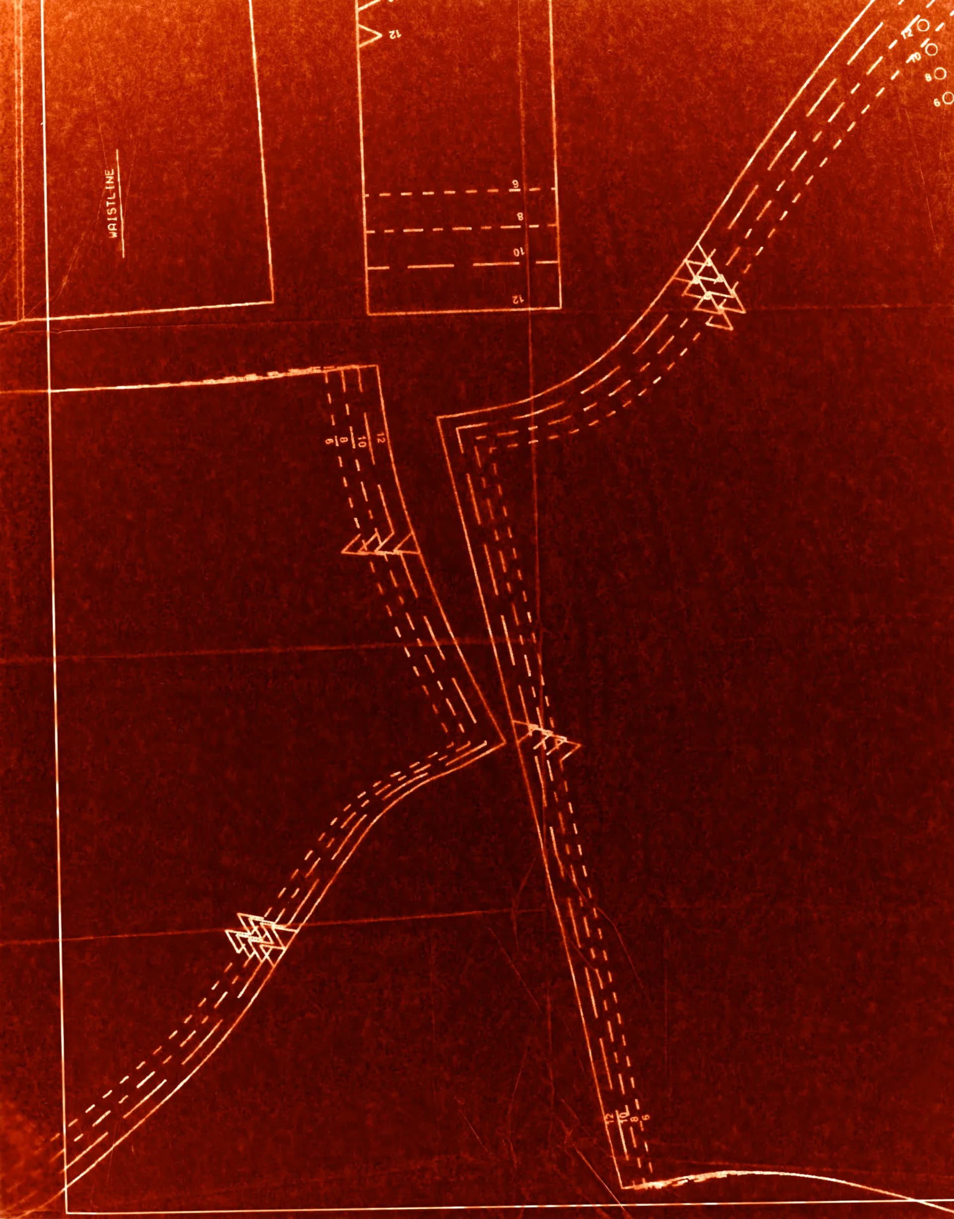 Deep red photogram of a sewing pattern with the word WAISTLINE visible