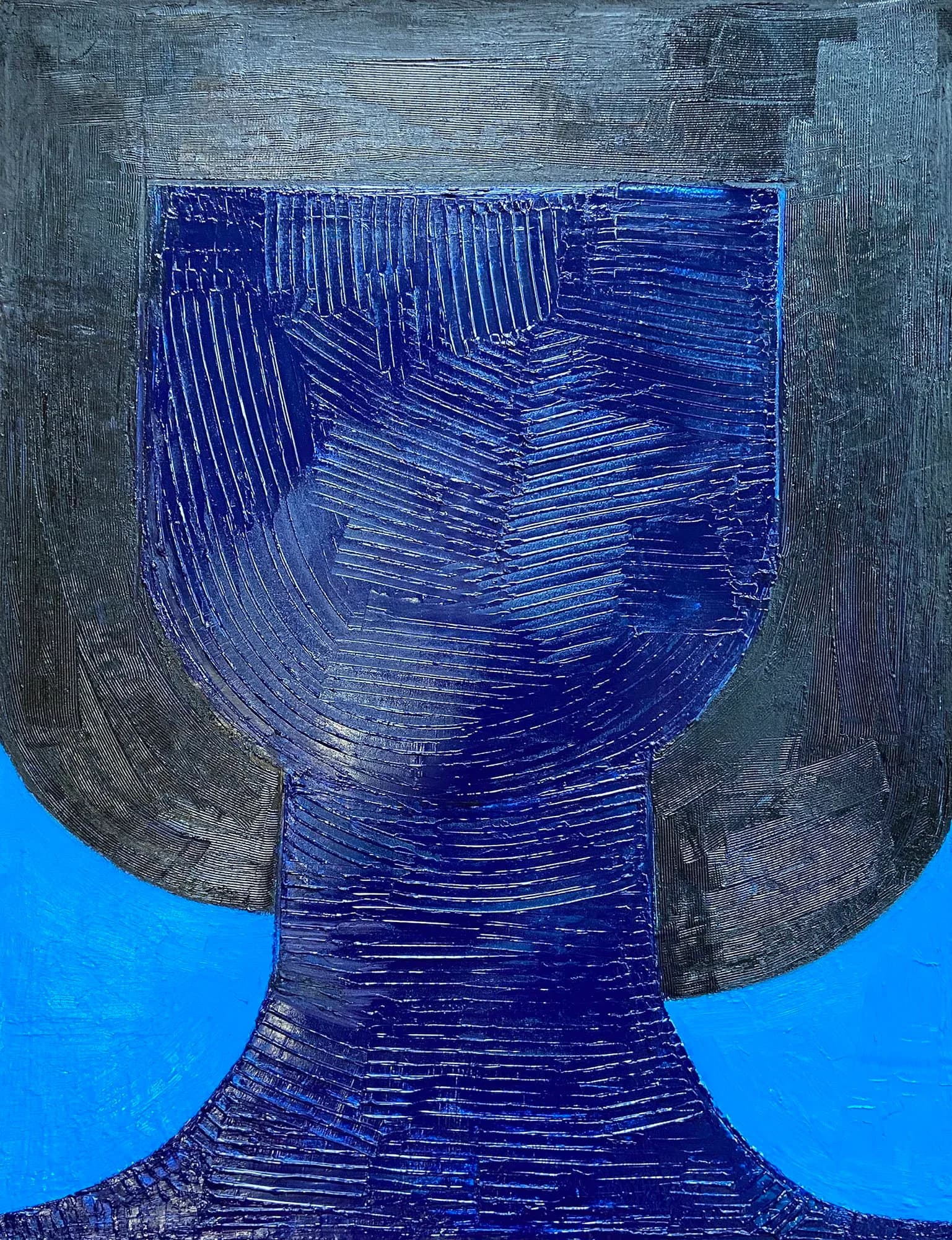Deep blue abstracted head or vessel form with scored line texture against cyan blue background