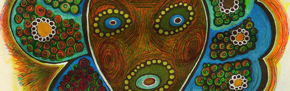 Mixed-media mask or face with three concentric circular eyes in blue, surrounded by intricate patterned shapes in greens, oranges, browns, and teals.