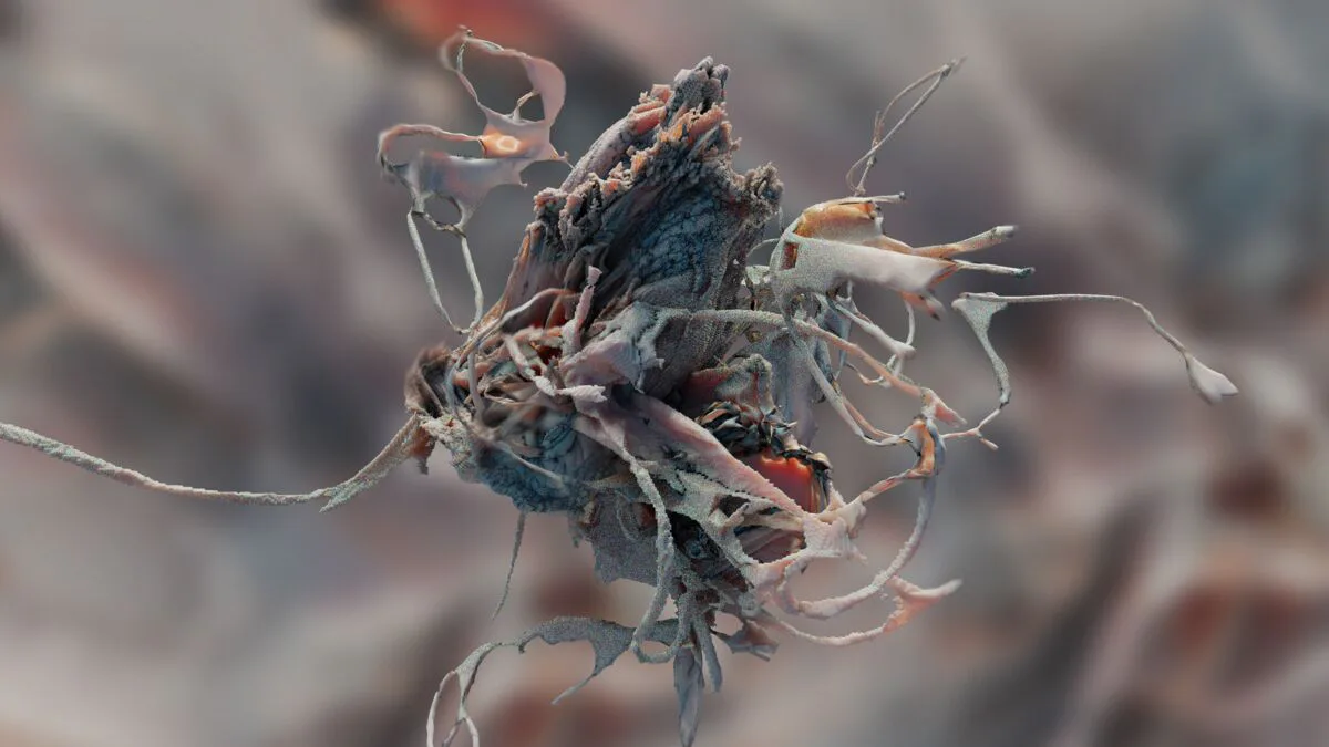 Microscopic or macro photograph of organic cluster with blue, red, and tan coloring; spindly protrusions and complex three-dimensional surface texture against blurred background.