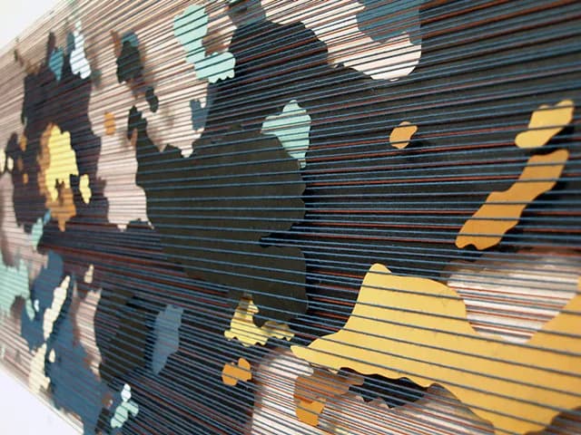 Mixed-media artwork with horizontal linear striations in dark tones overlaid with a map silhouette in yellow, teal, and pale blue.