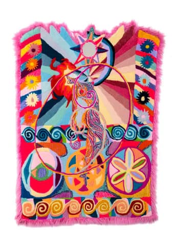 Colorful fiber/textile artwork with psychedelic figures, peace symbols, and floral motifs on pink fur border