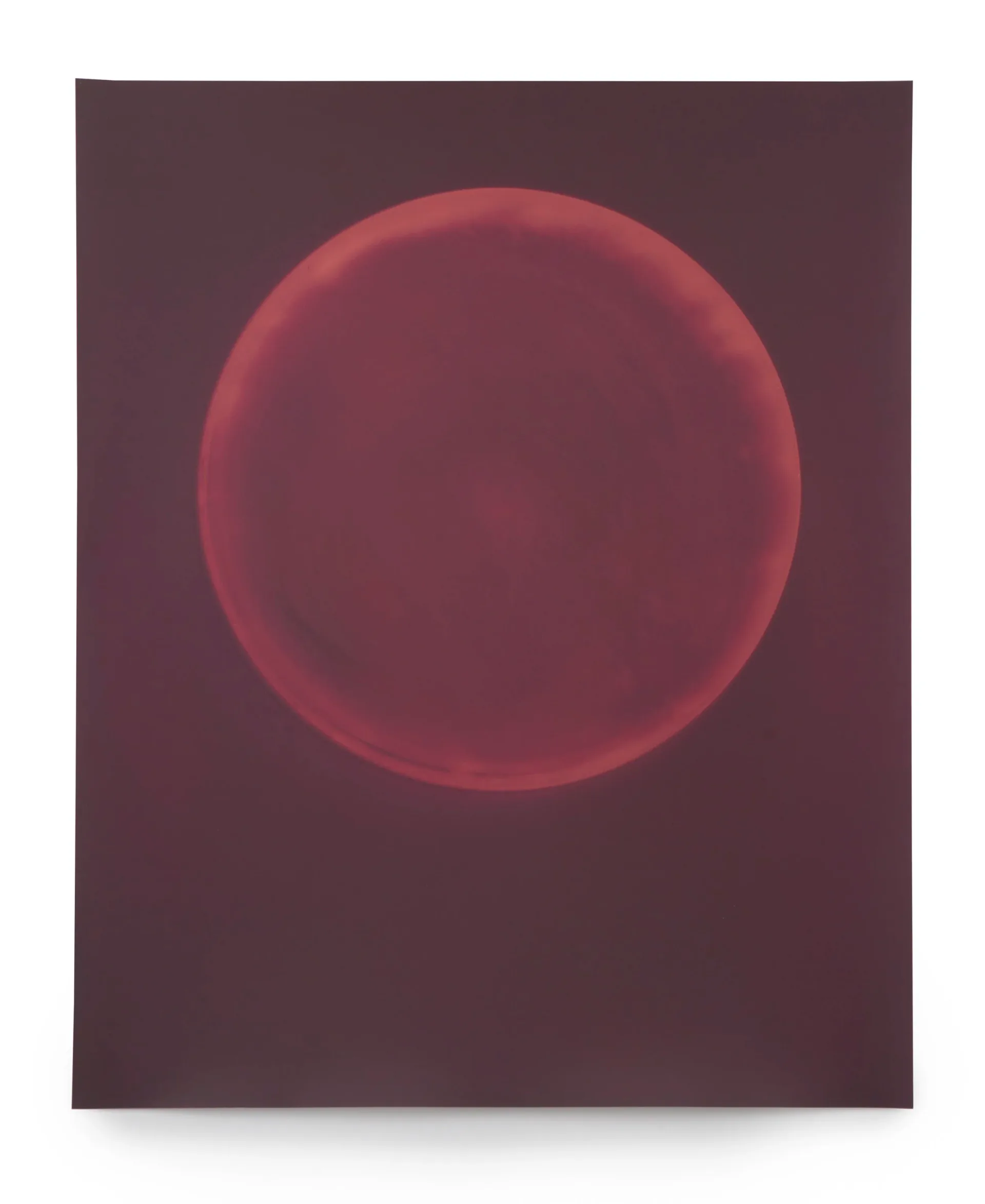 Abstract painting with luminous red-crimson circle on deep burgundy ground