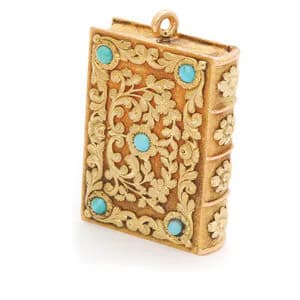 Gold filigree rectangular pendant or locket with turquoise cabochon stones set symmetrically across an ornate carved surface.