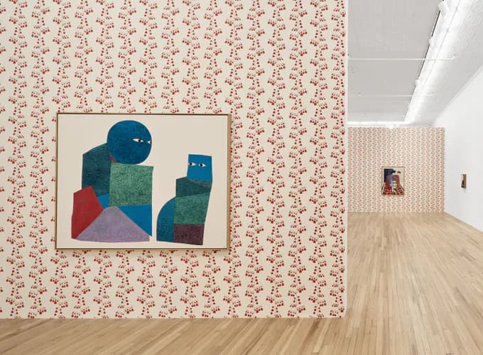 Gallery installation view with patterned wallpaper in red and cream, featuring a framed geometric abstract painting in greens and blues on the wall.