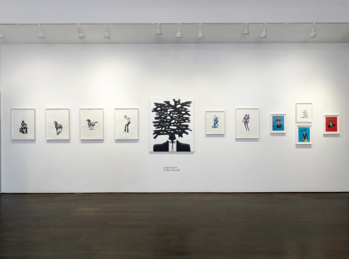 Chase Contemporary gallery wall with series of framed black and white drawings and a central sculptural tree form made of dark material; minimalist white gallery aesthetic.