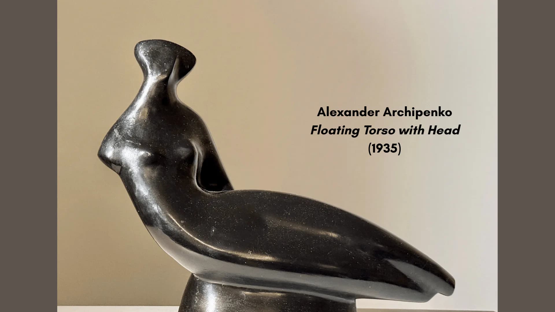 Dark bronze abstract sculpture by Alexander Archipenko, Floating Torso with Head (1935), showing elongated curved form with head detail.