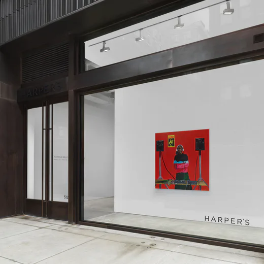 Harper's gallery entrance with minimalist red abstract artwork on white wall, modern black frame and glass storefront, polished concrete floor.