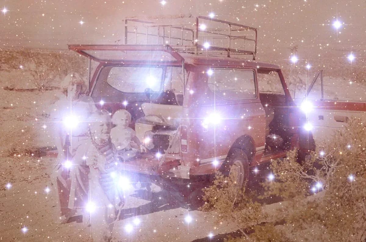 Mixed-media artwork of a jeep covered in bright white sparkles and glitter against a dusty, sandy background.