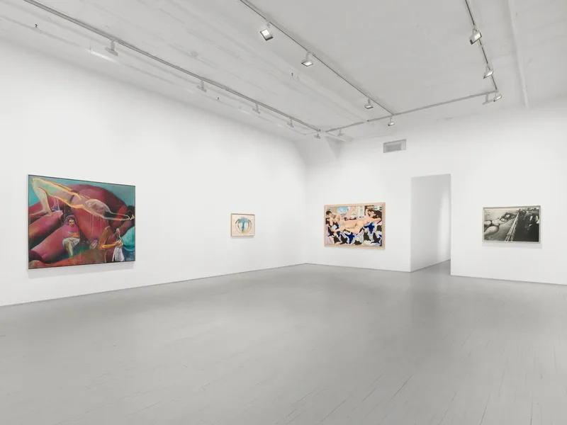 A bright, minimalist gallery interior at James Fuentes with white walls, polished concrete floor, and four artworks displayed on separate walls under track lighting.