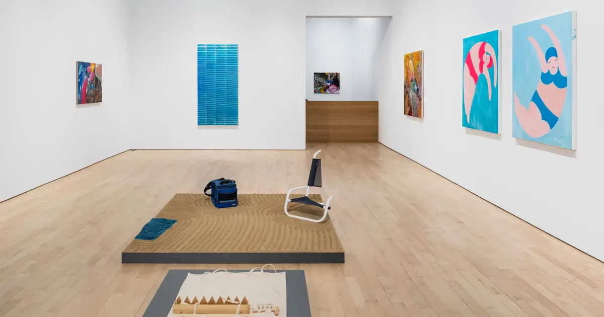 Gallery interior at Jane Lombard Gallery with wooden floor, colorful artworks on white walls, and sculptural installations on a platform.