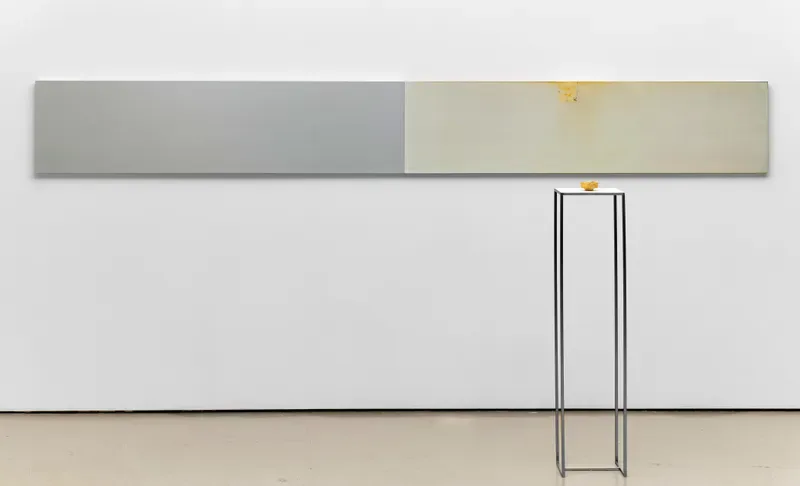 Minimalist gallery wall at Jane Lombard Gallery with gray and beige horizontal panels and metal structural elements on wooden floor.