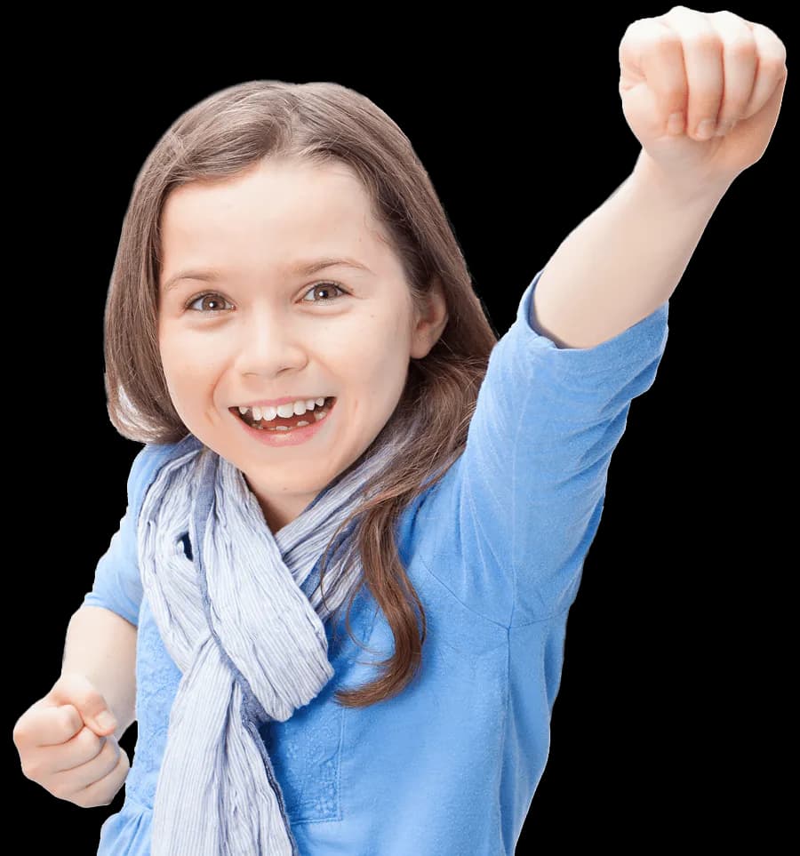 Studio portrait of smiling child in blue shirt with light scarf, fist raised in celebratory pose against white background.