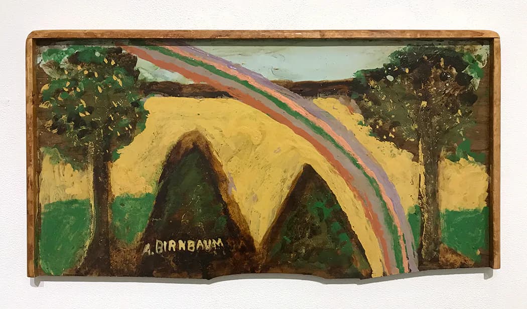 Folk art painting on wood panel depicting two dark mountain peaks beneath a yellow sky with a rainbow, flanked by green trees, signed A. Giambanna.