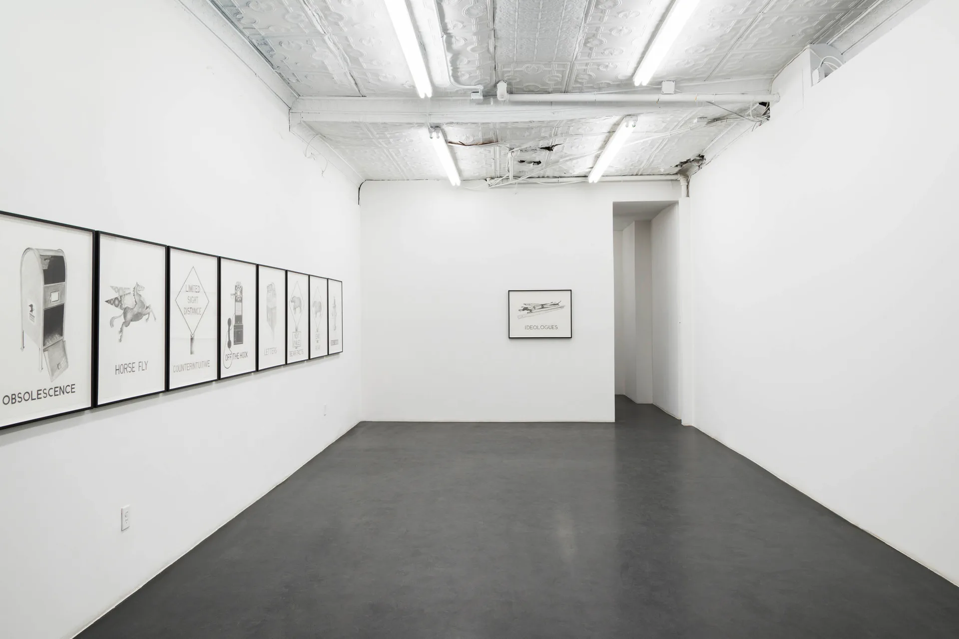 Gallery interior at Maxwell Graham / Essex Street with dark gray floor, white walls, framed line drawings on left wall, doorway visible.