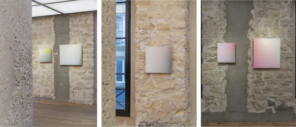 Three gallery installations of light boxes mounted on weathered stone and concrete walls in Off Paradise's industrial space.