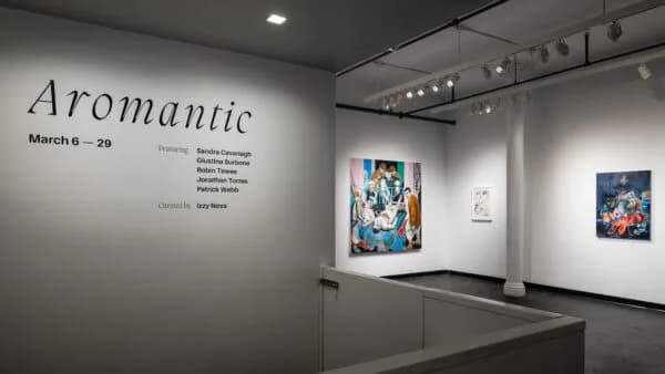 Interior photograph of a white gallery wall at PAINTING SPACE 122 displaying two colorful paintings; 'Aromantic' exhibition title visible on left wall, March 6-29.