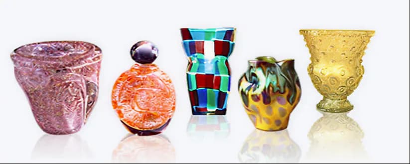 Five decorative glass and ceramic vessels in varied colors and textures: pink textured vessel, orange sphere, colorful geometric vase, patterned yellow-and-dark vessel, and amber-tinted glass goblet.
