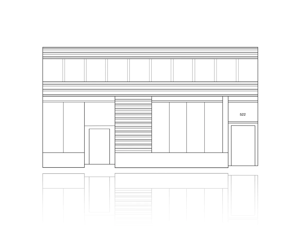 Architectural elevation line drawing of a storefront facade with gridded upper windows, horizontal siding detail, entry doors, and retail signage rendered in black ink.