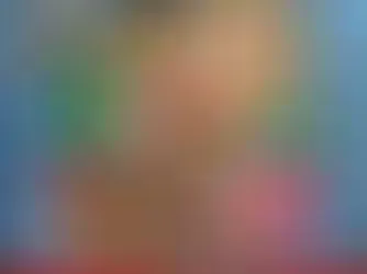 Blurred abstract image with soft gradient colors transitioning between blue, pink, green, and peachy tones.